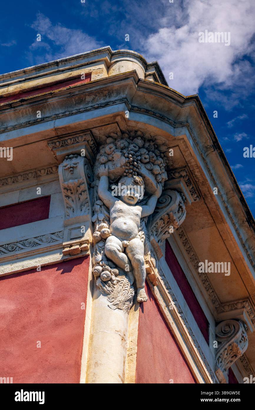 Angel sculpture on the corner of an old building facade in Catania ...