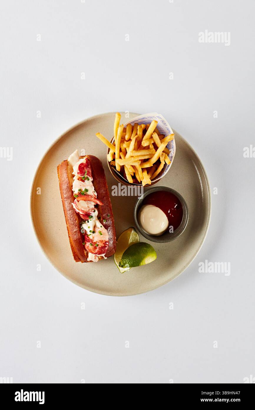 Lobster roll with chips and dips Stock Photo