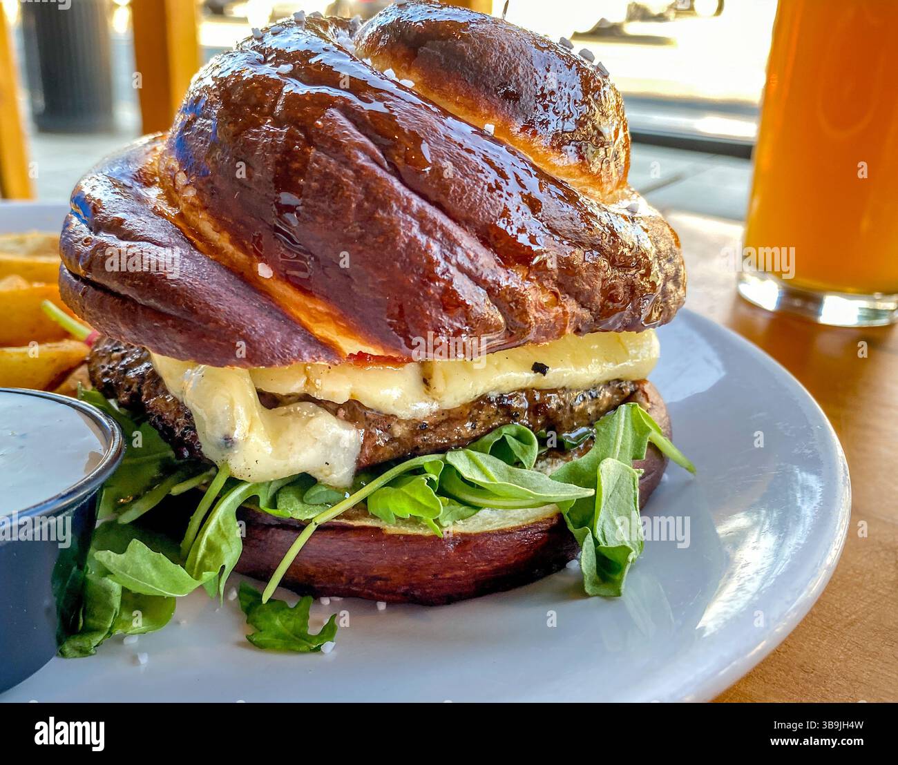 Gourmet hamburger on crossant bun - Smartphone Captured Stock Image