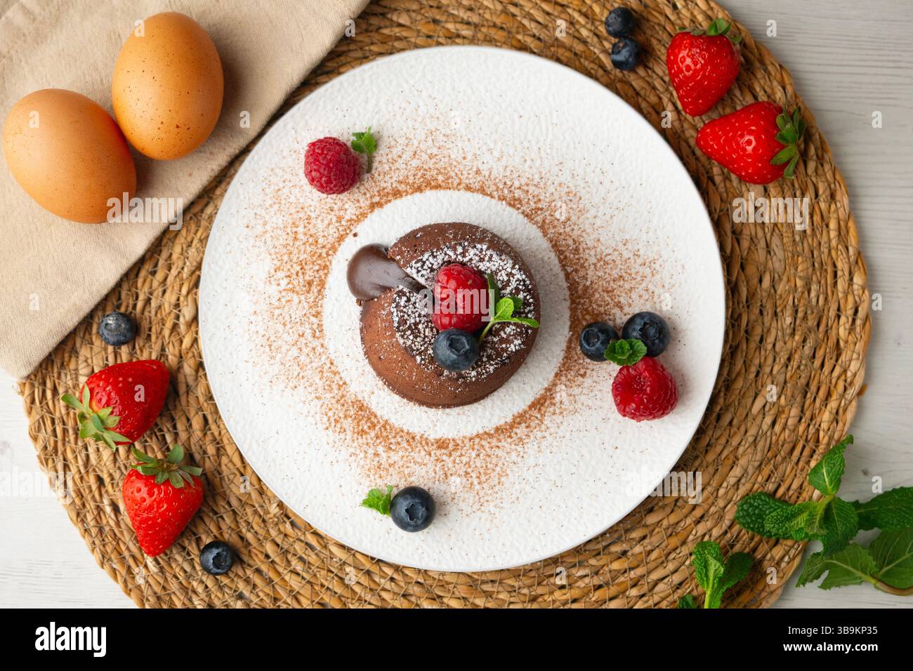 Beautiful chocolate lava cake coulant from a top view with christmas decorations. Stock Photo