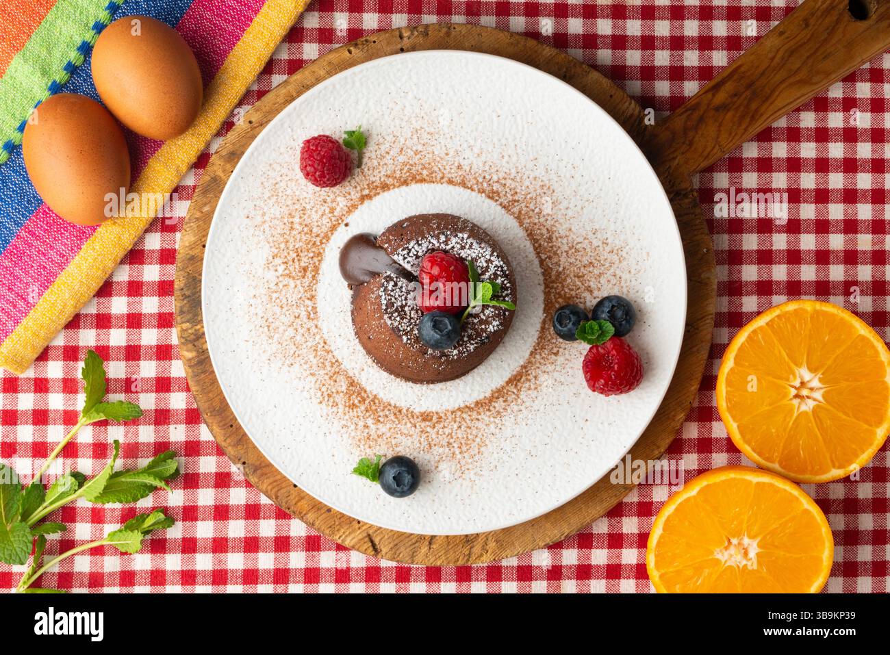 Beautiful chocolate lava cake coulant from a top view with christmas decorations. Stock Photo