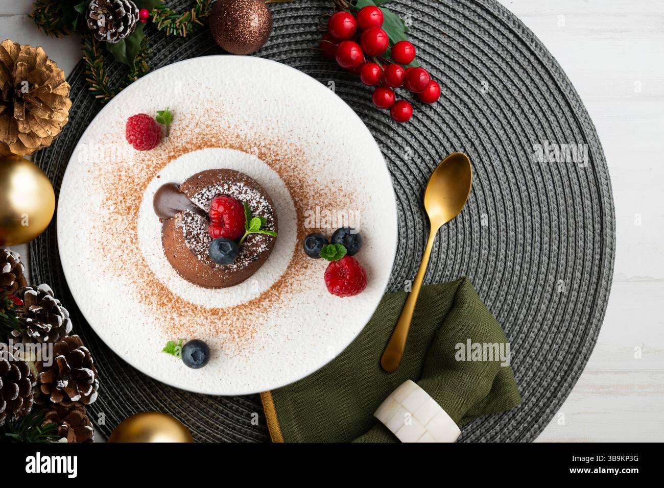 Beautiful chocolate lava cake coulant from a top view with christmas decorations. Stock Photo