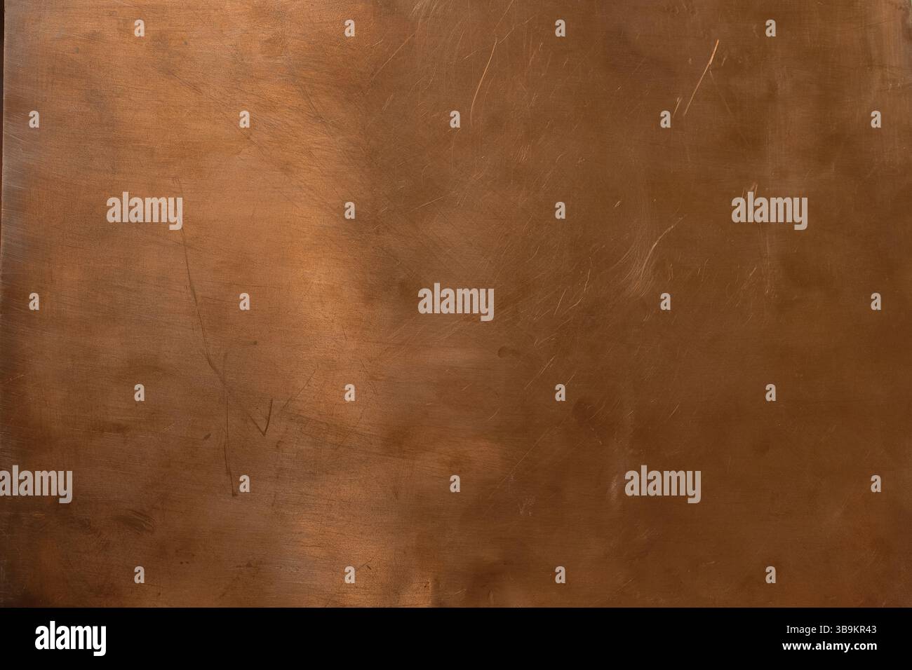Copper backdrop. Scratched copper surface. Brass or copper background. Left natural lighting. Copy space. Stock Photo