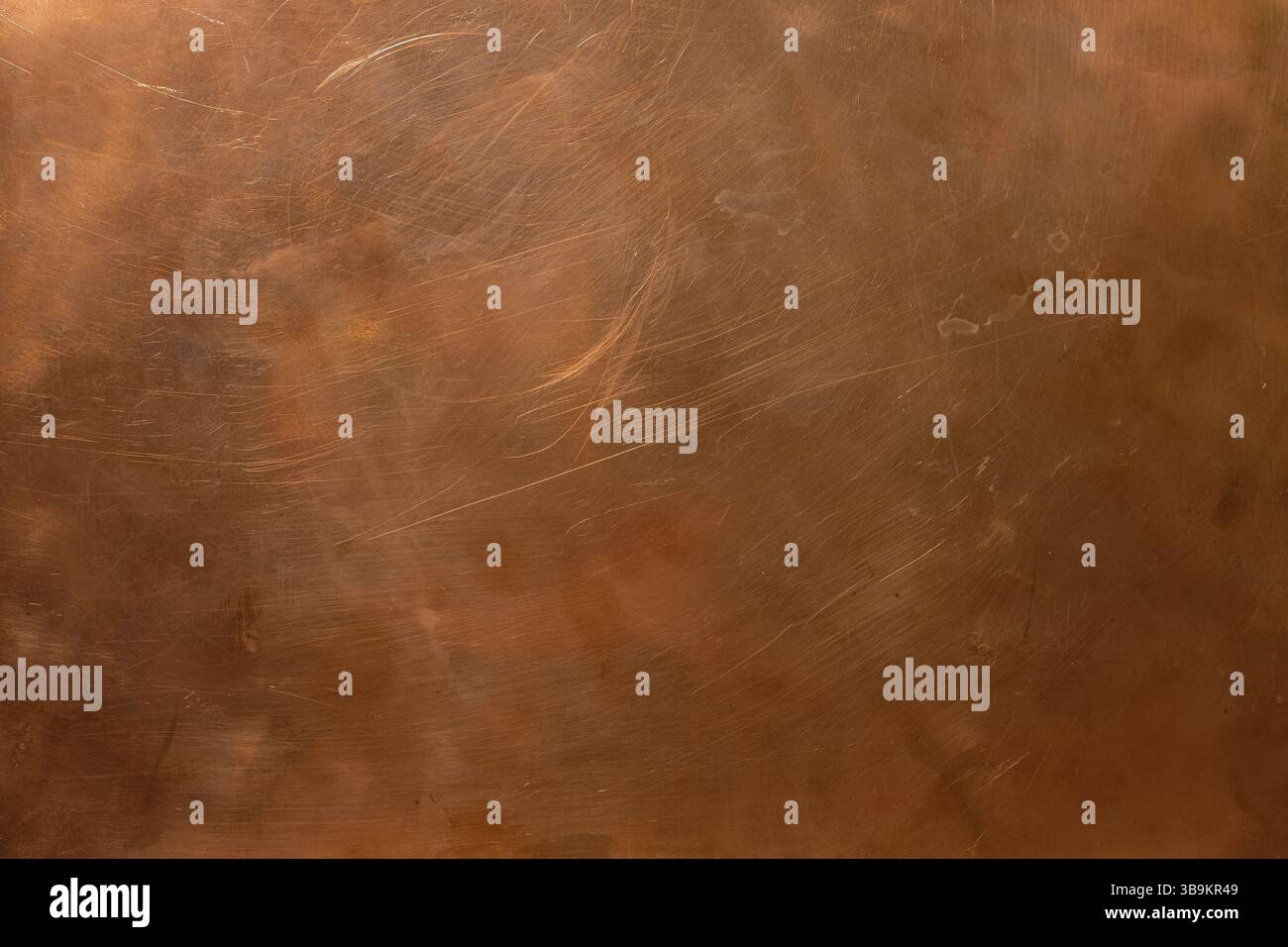 Copper backdrop. Scratched copper surface. Brass or copper background. Left natural lighting. Copy space. Stock Photo