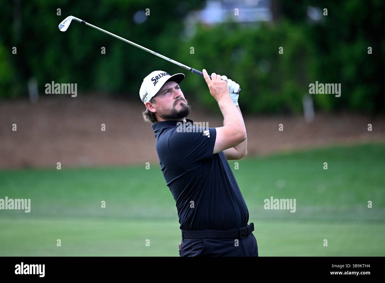 Andrew Novak looks on after hitting his shot from the first fairway ...