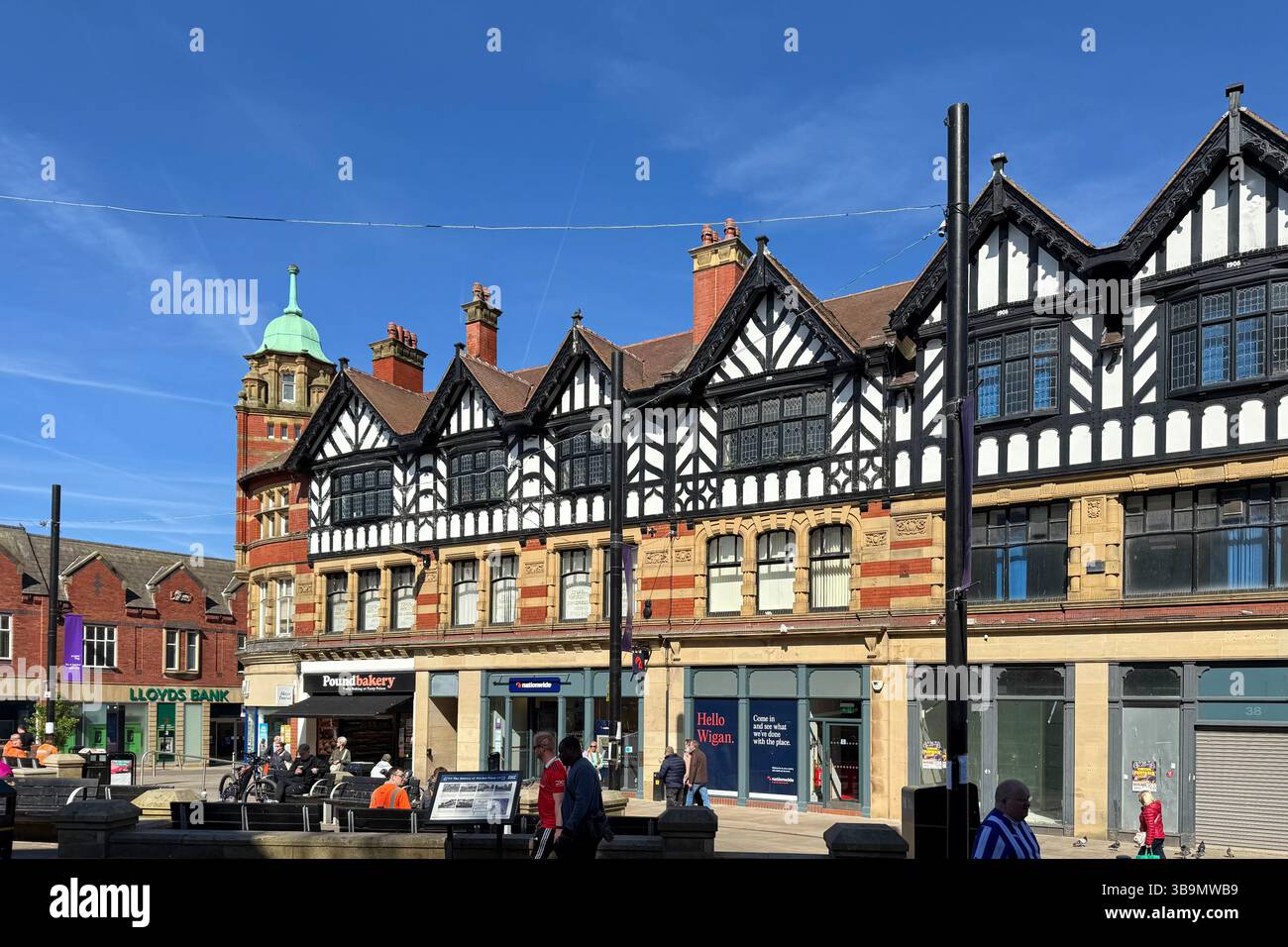 People shopping in Market Place, Wigan town centre - Smartphone Captured Stock Image