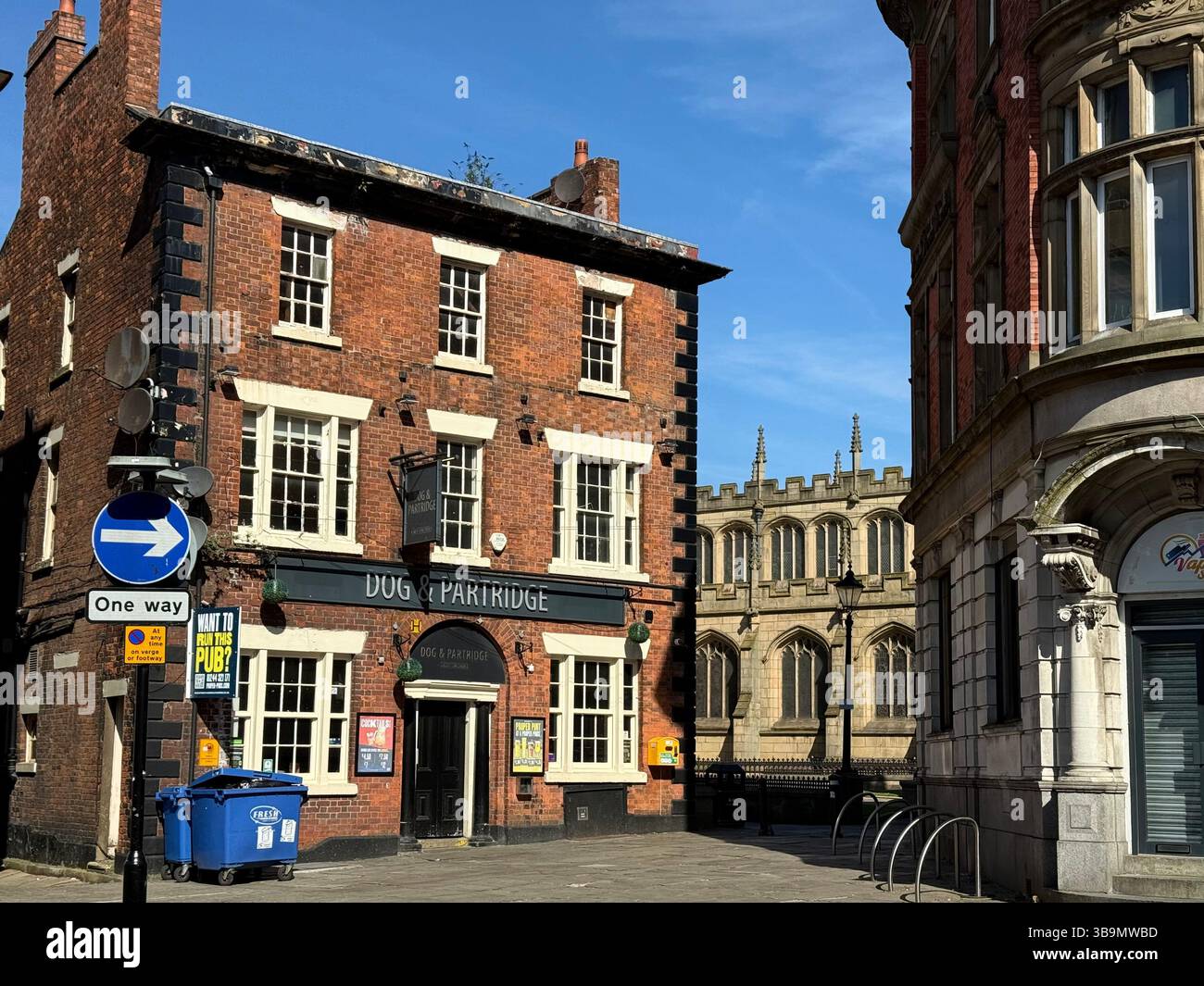 Wallgate in Wigan town centre showing Dog an partridge pub and part of Parish church of All Saints - Smartphone Captured Stock Image