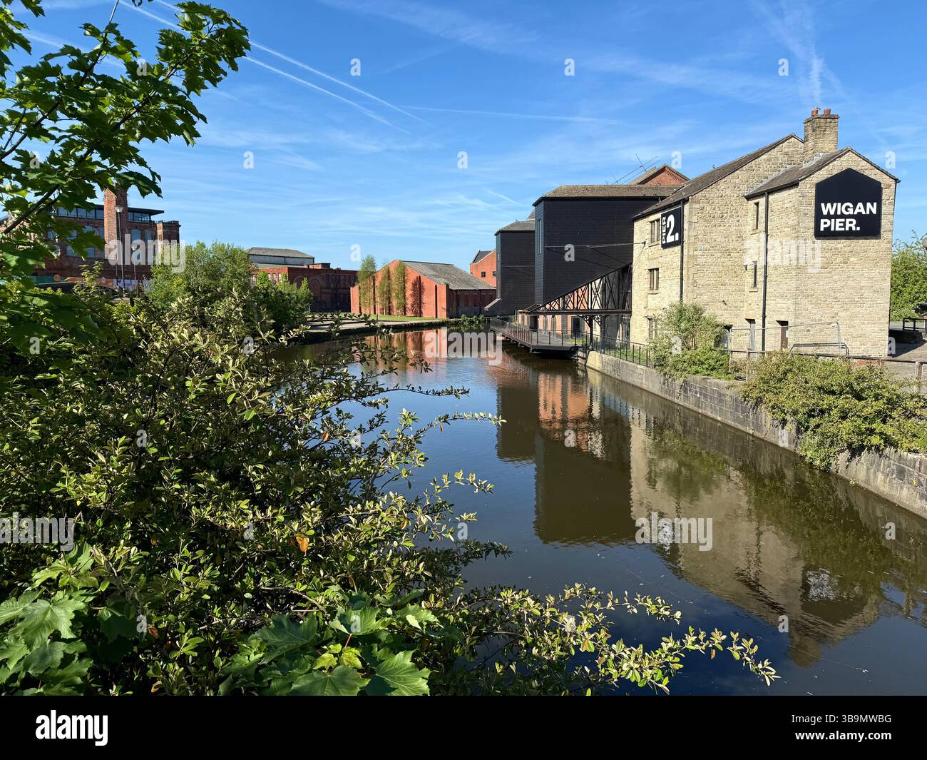 Wigan Pier with buildings reflected in the Leeds and Liverpool canal - Smartphone Captured Stock Image