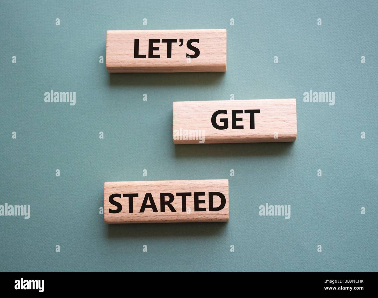 Lets get started symbol. Concept words Lets get started on wooden ...