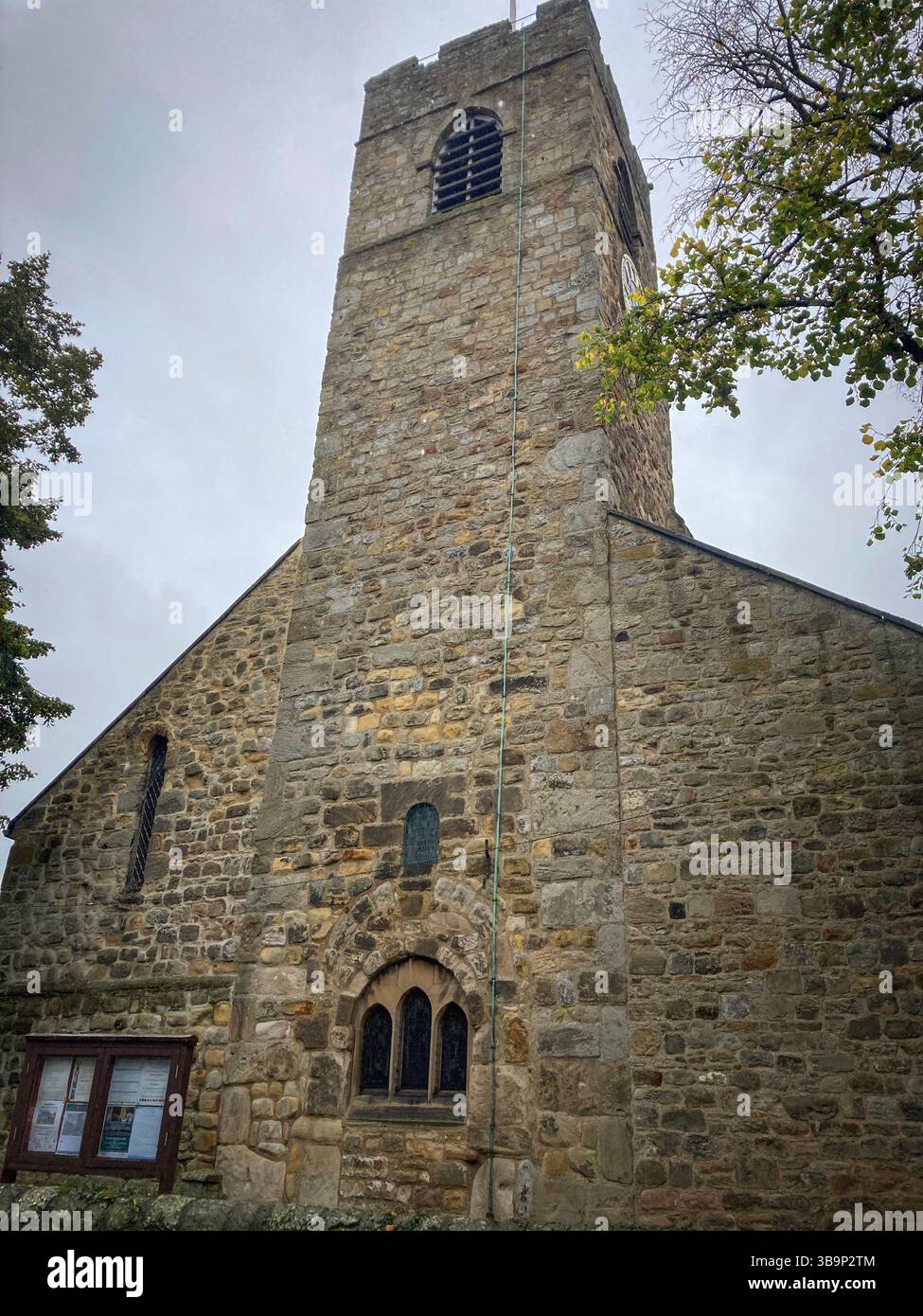 The west end view of St Andrews church Tower, Corbridge, Northumberland, England, UK, with Roman and Anglo Saxon Features and origins - Smartphone Captured Stock Image