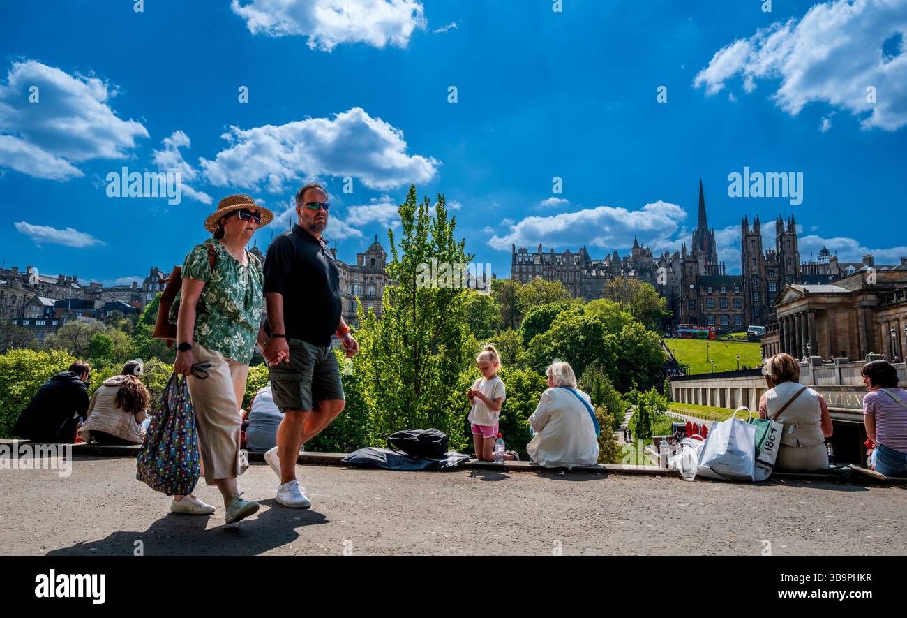 People enjoying the warm spring sunshine in Princes Street Gardens in ...