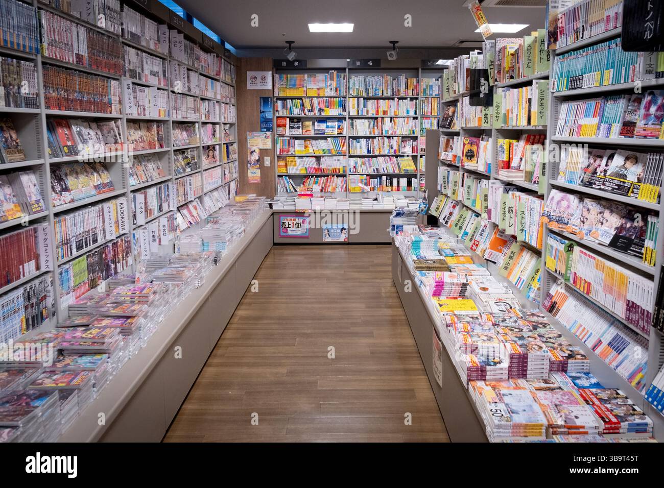 Kyoto, Lapan, April 23 2025: Japanese bookstore showing many manga and books for sale on shelves, creating a colorful and inviting atmosphere Stock Photo