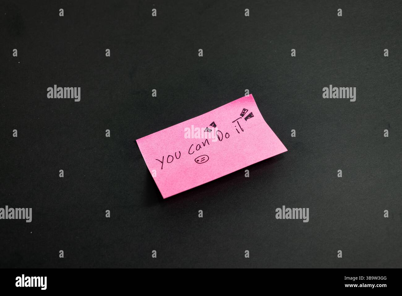 Pink notes with a writing that says you can do it Stock Photo