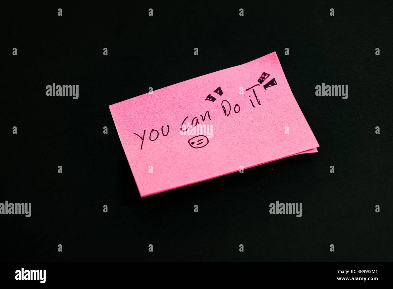 Pink notes with a writing that says you can do it Stock Photo
