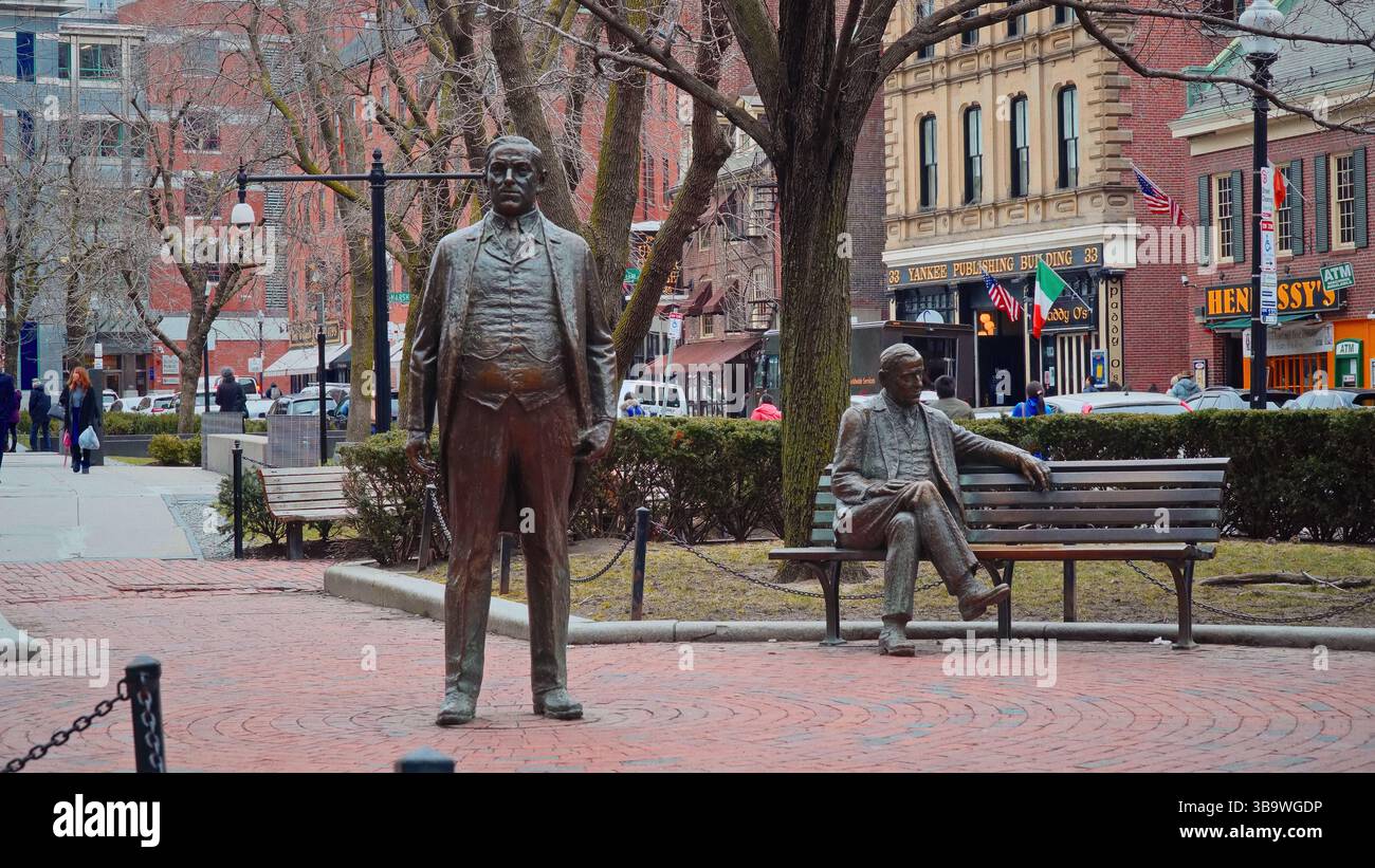 BOSTON, USA - APRIL 3, 2017 - Bronze statues of James Michael Curley and an unknown man sitting on a bench in Boston Stock Photo