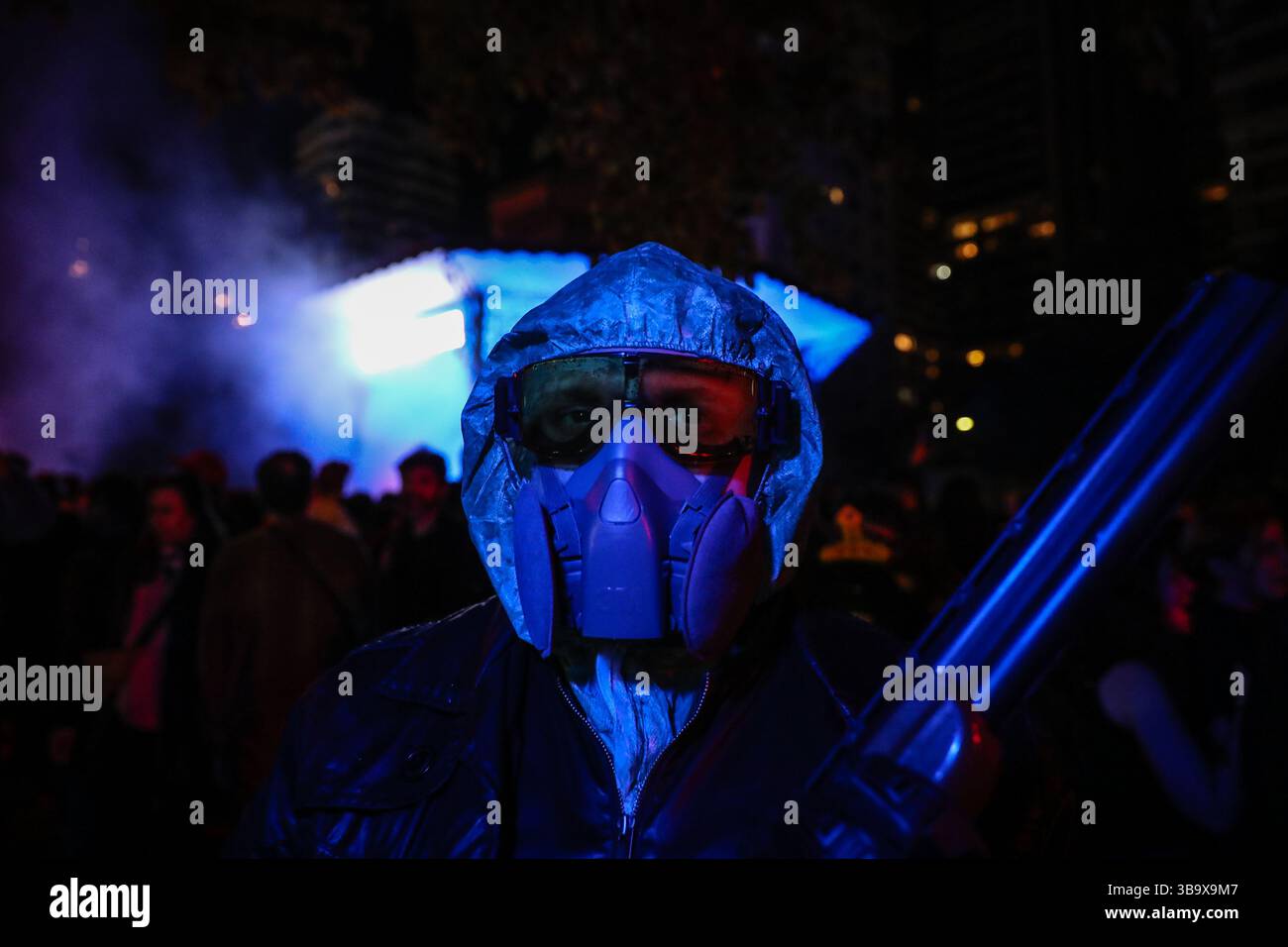 Buenos Aires, Argentina. 10th May, 2025. A person with a gasmask seen during the recreation of the final scene of the serie The Eternauta. Netflix held an event at the Barrancas de Belgrano roundabout, the location of the final scene of the first season, to celebrate the success of the streaming platform's series based on the comic book by Héctor Germán Oesterheld. Credit: SOPA Images Limited/Alamy Live News Stock Photo