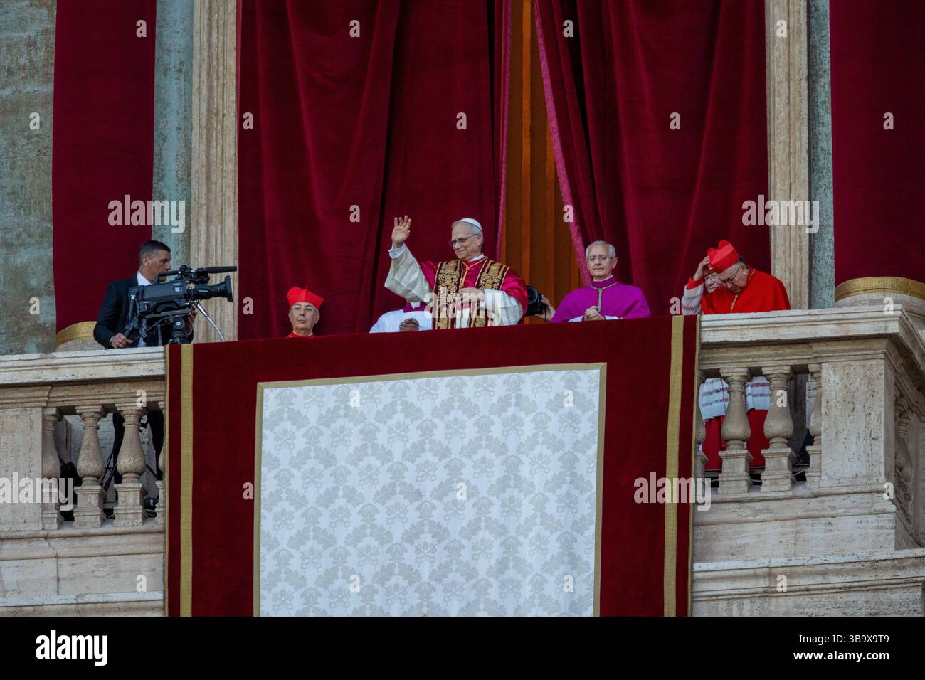 Vatican City newly elected Pope Leo XIV Robert Francis Prevost waves from St Peter Basilica central loggia balcony after conclave election Stock Photo