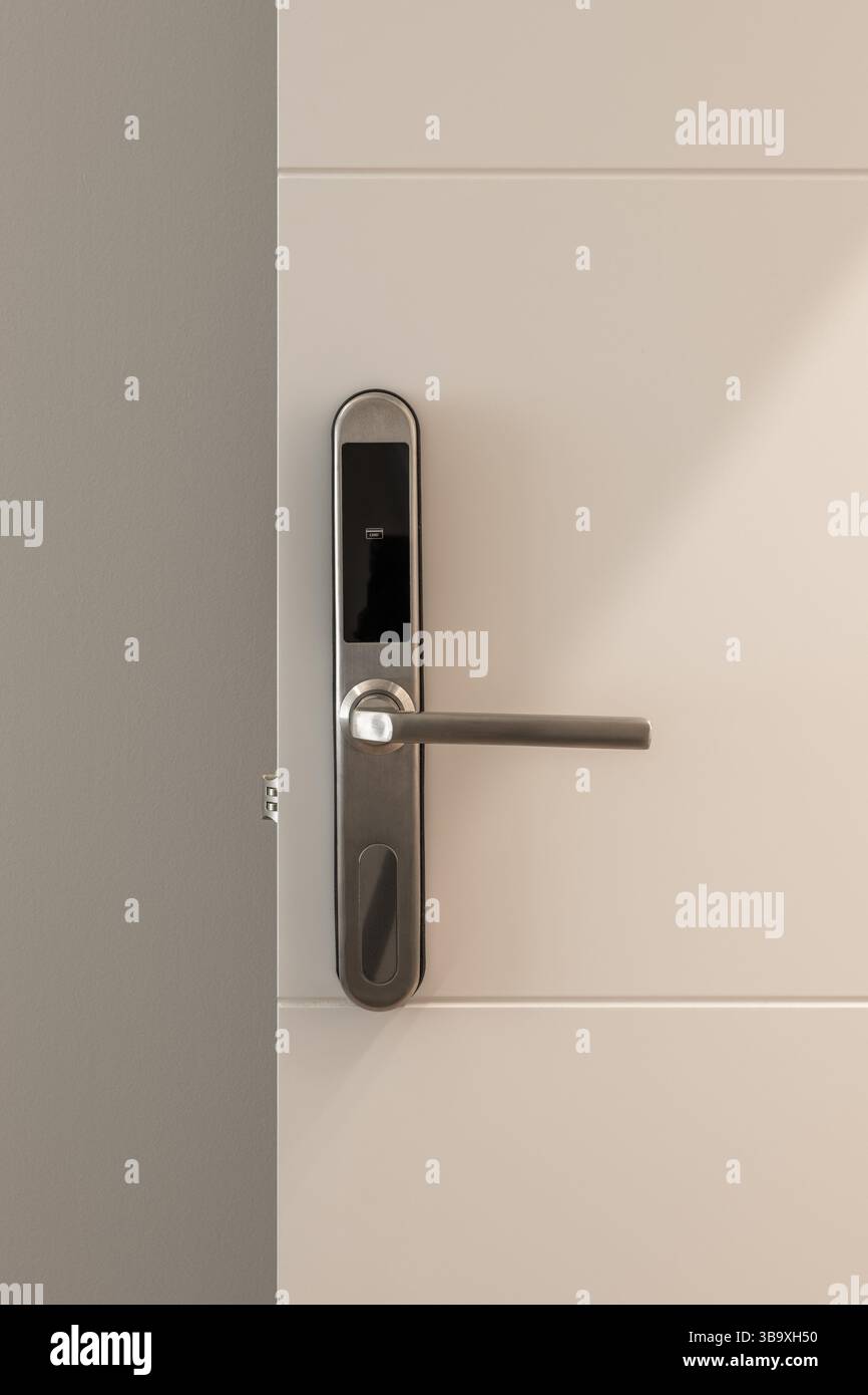 Front view of modern electronic door lock with stainless steel handle ...