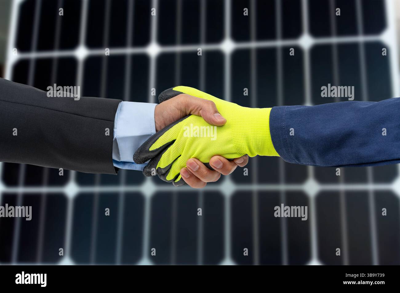 Engineer and customer shaking hands after successful installation of ...