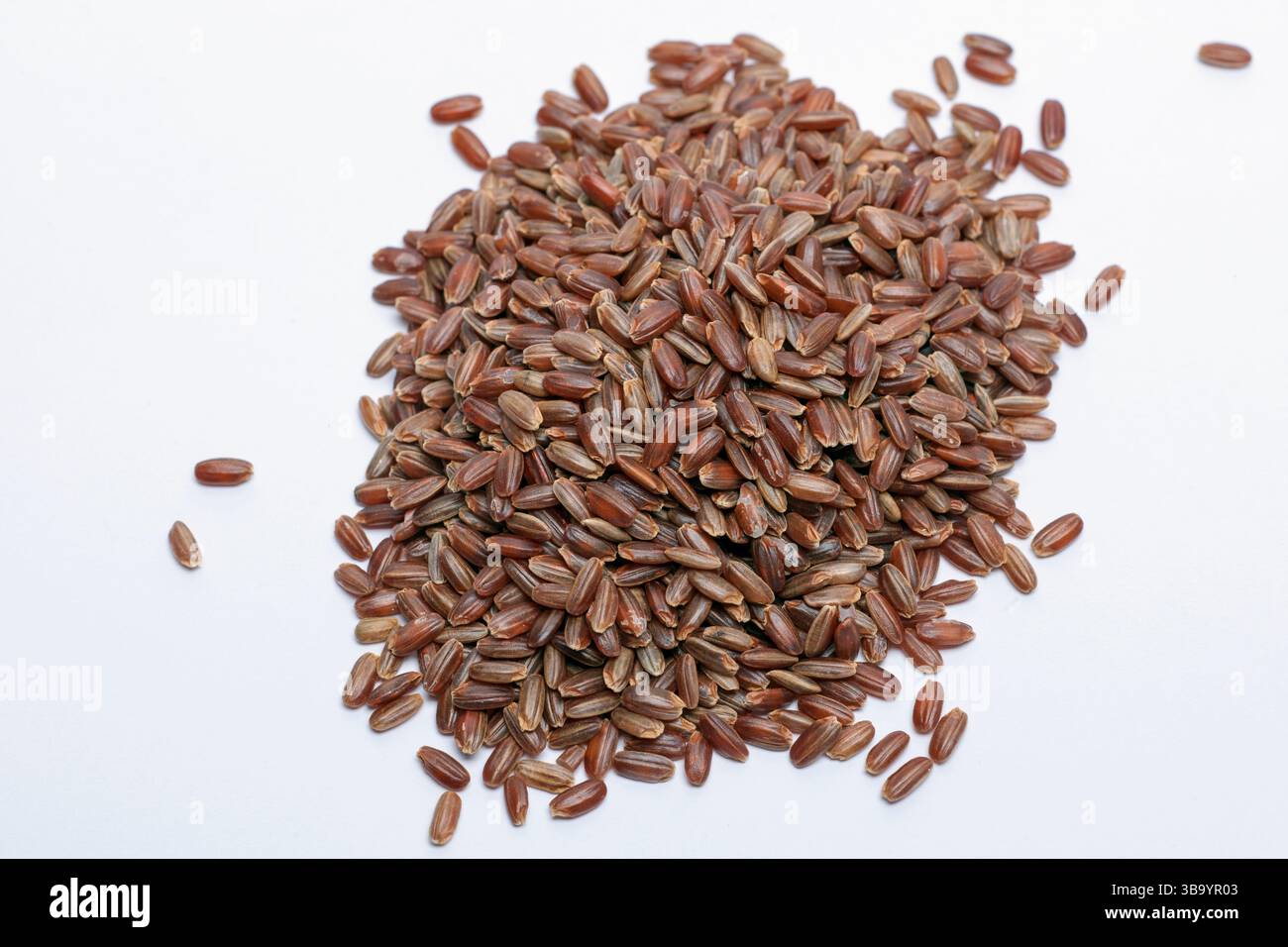 Pile of Red Rice on a white background Stock Photo