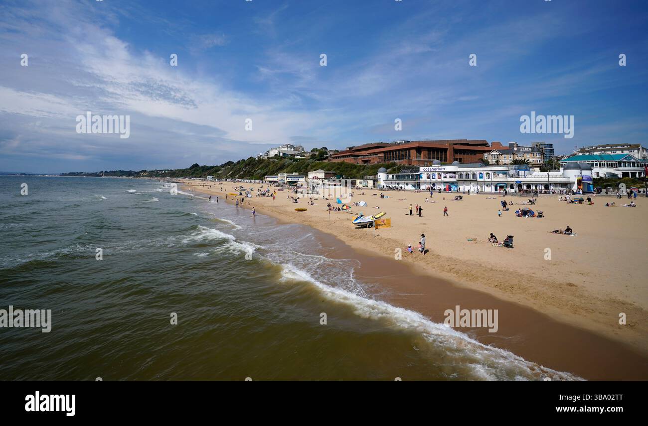 People enjoy the warm weather on Bournemouth Beach in Dorset. Heavy ...