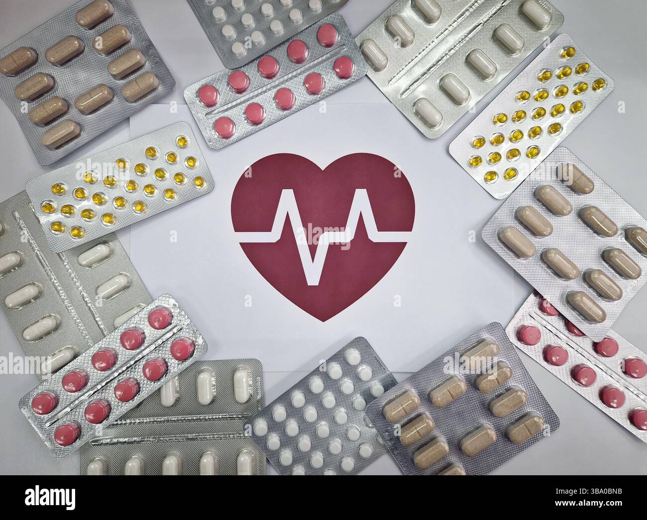 Various blister packs of pills arranged around a red heart symbol with an electrocardiogram, ECG pulse line inside. Drugs of different shapes and colo - Smartphone Captured Stock Image