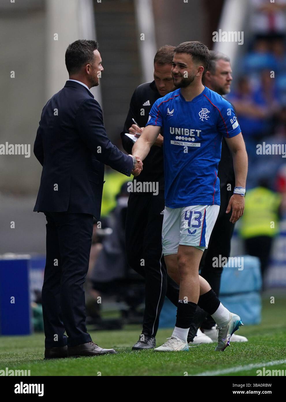 Rangers' Nicolas Raskin with interim manager Barry Ferguson as he ...