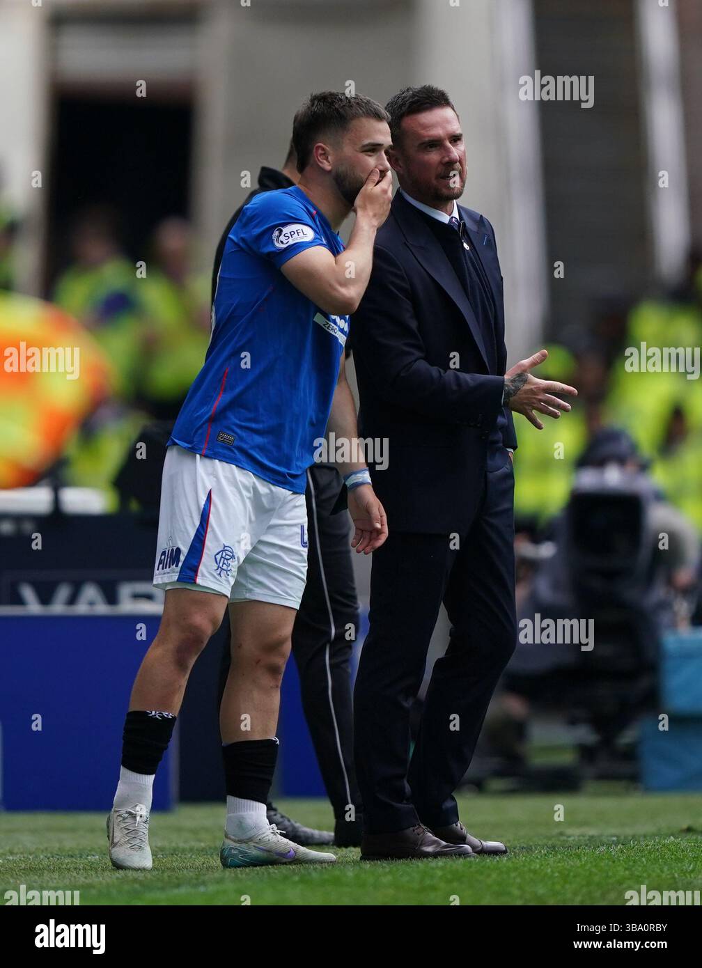 Rangers' Nicolas Raskin with interim manager Barry Ferguson as he ...