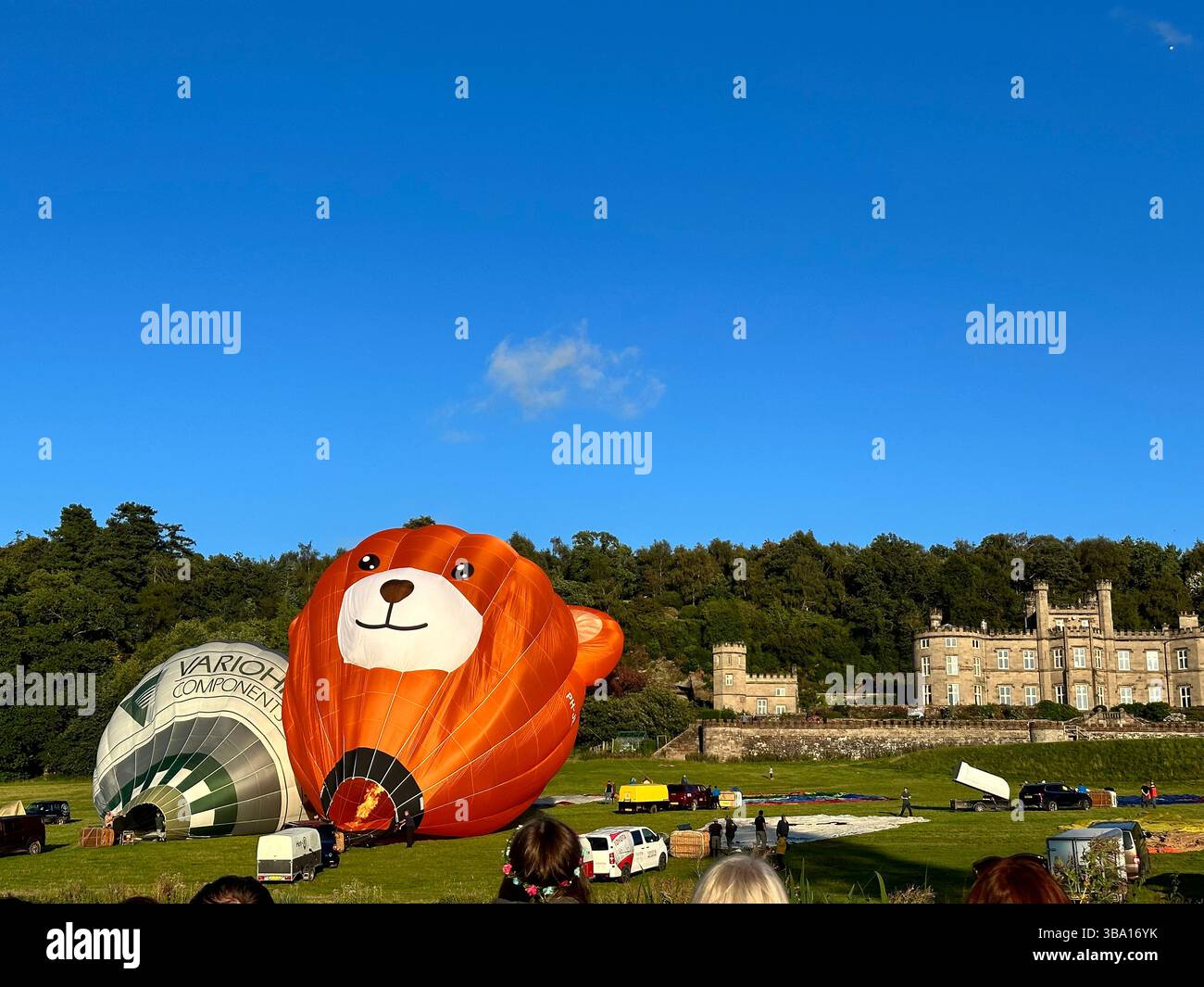Hot air balloons being prepared for flight at Cheshire Balloon Fiesta, Tattenhall Castle, Chester, Bolesworth Estate, UK, 6 August 2023. Editorial Use - Smartphone Captured Stock Image