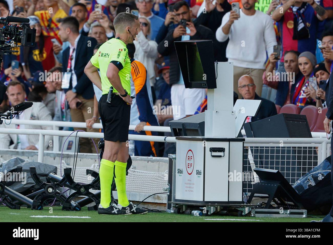 Referee checks for a possible penalty during the La Liga soccer match ...