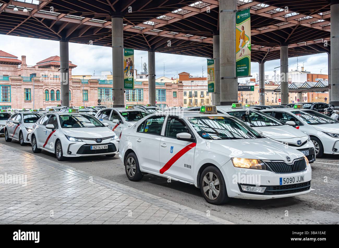 Madrid, Spain - 03.10.2025: Many taxi cars waiting for clients at Atocha Station. Stock Photo