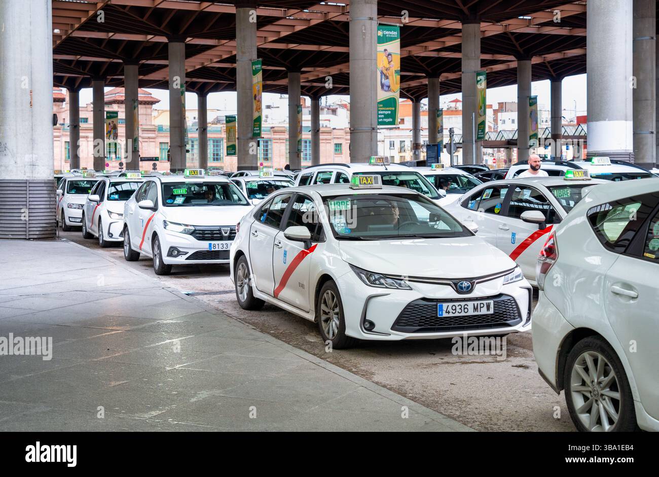 Madrid, Spain - 03.10.2025: Many taxi cars waiting for clients at Atocha Station. Stock Photo