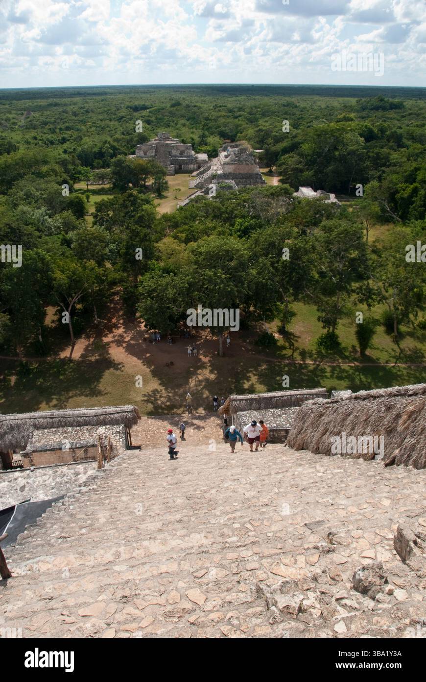 Tourists climb steep steps at the Acropolis, at the Mayan ...