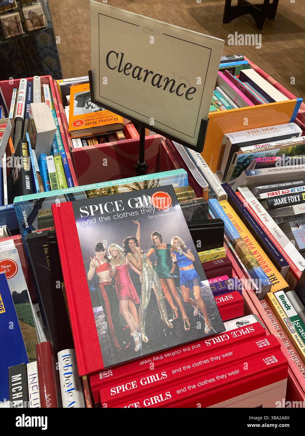 Spice Girls and the Clothes they wear, hardback book by Terry Newman in the clearance section at the book store - Smartphone Captured Stock Image