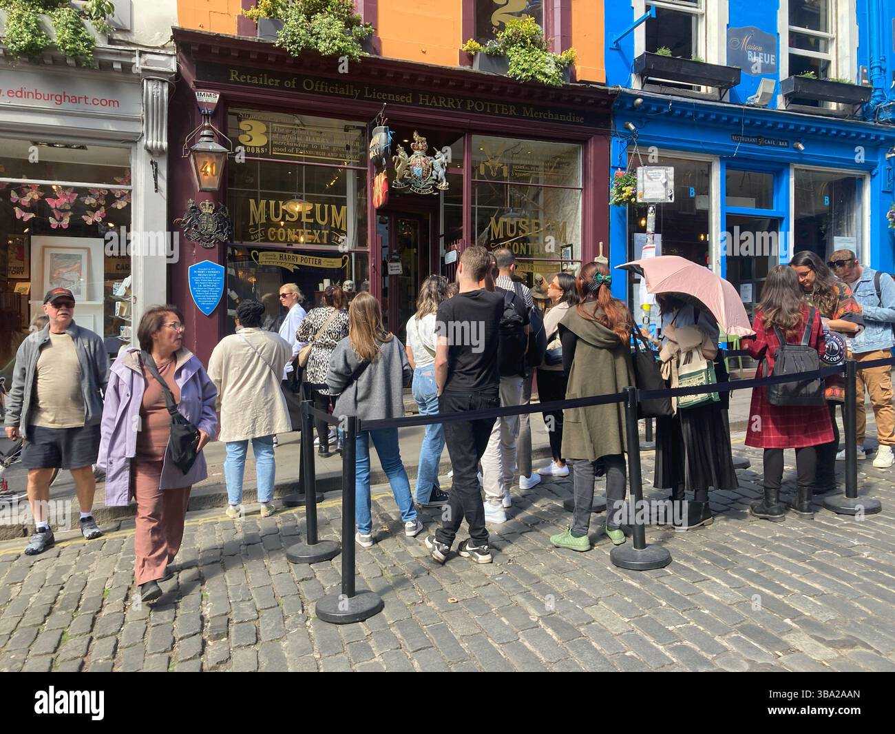 Queues awaiting entry outside the Harry Potter Museum, Victoria Street Edinburgh, Scotland Stock Photo