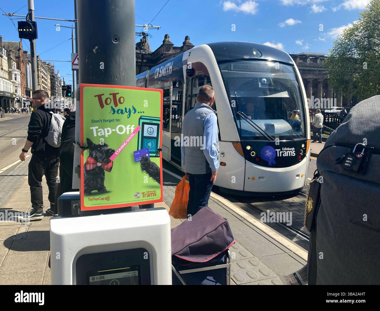 Publicity on the tram platform for the Tap on Tap Off system being implemented on Edinburgh Trams from the 19th May, Princes Street Edinburgh Scotland Stock Photo