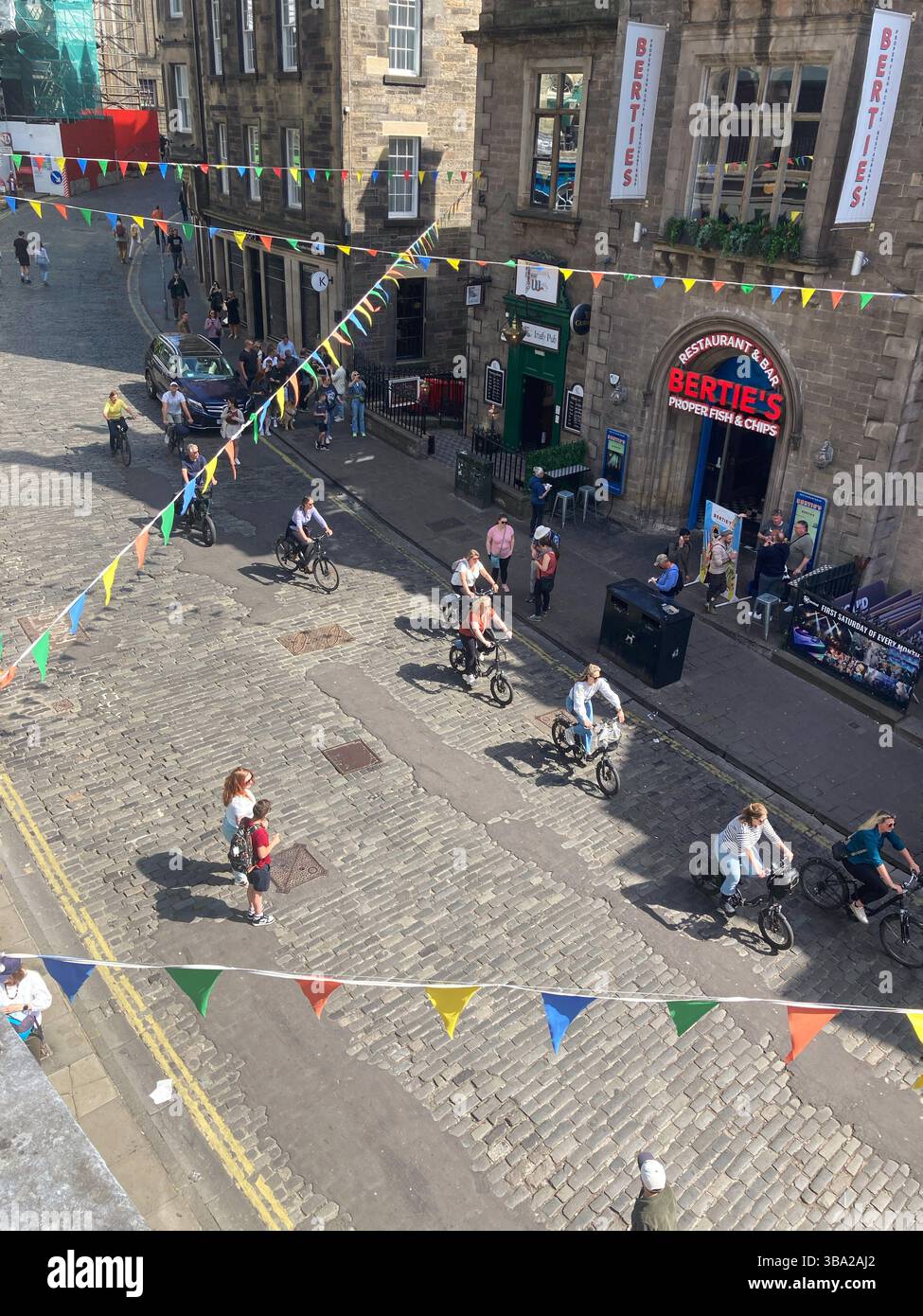 Bertie's Fish and Chips on Victoria Street with flags and bunting, Edinburgh Scotland - Smartphone Captured Stock Image