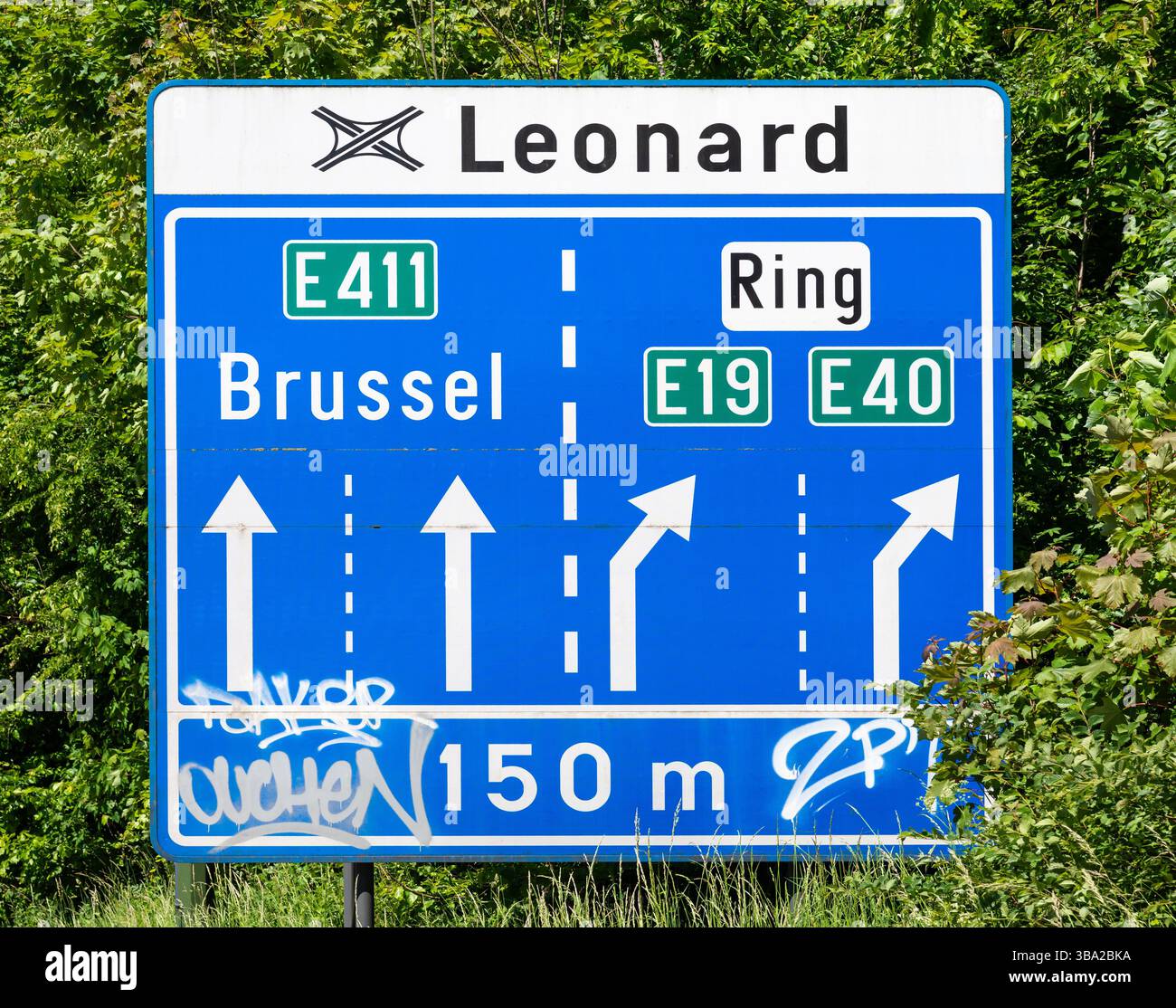 Blue Belgian road signs at the Leonard junction in Auderghem, Brussels ...