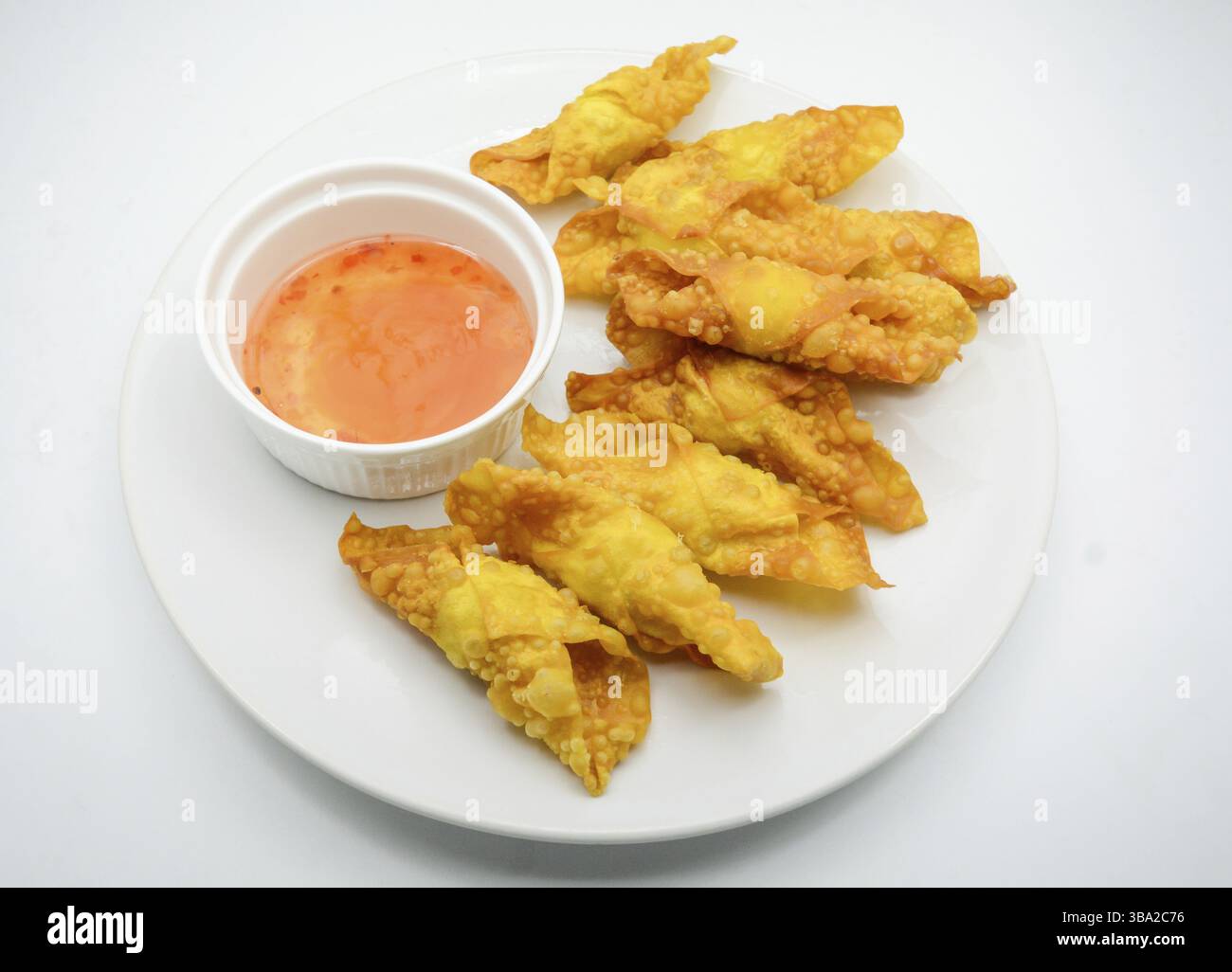 Deep Fried Won ton on white plate with dip source Stock Photo