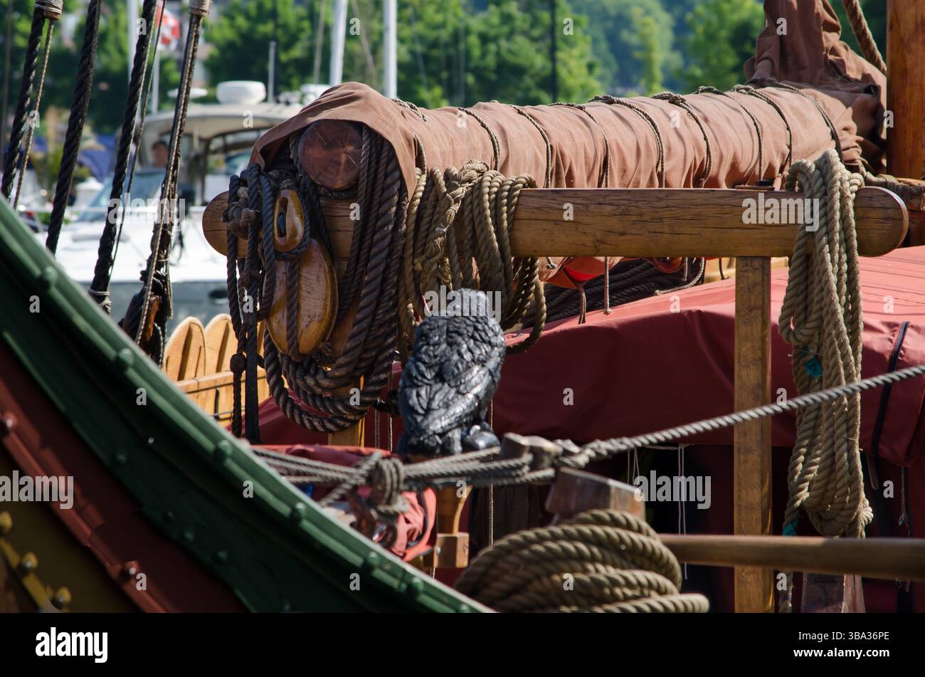 Canvas Load Rope Canvas covered coiled ropes on a post and beam of a viking ship replica ...