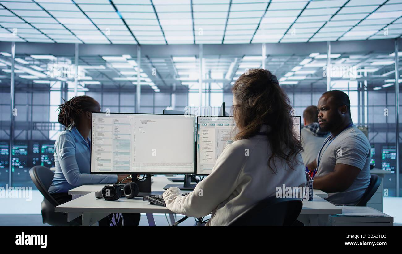 Admin arriving in server hub, sitting at computer desk, checking ...