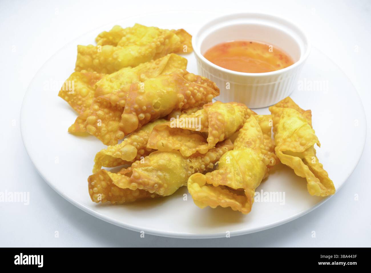 Deep Fried Won ton on white plate with dip source Stock Photo