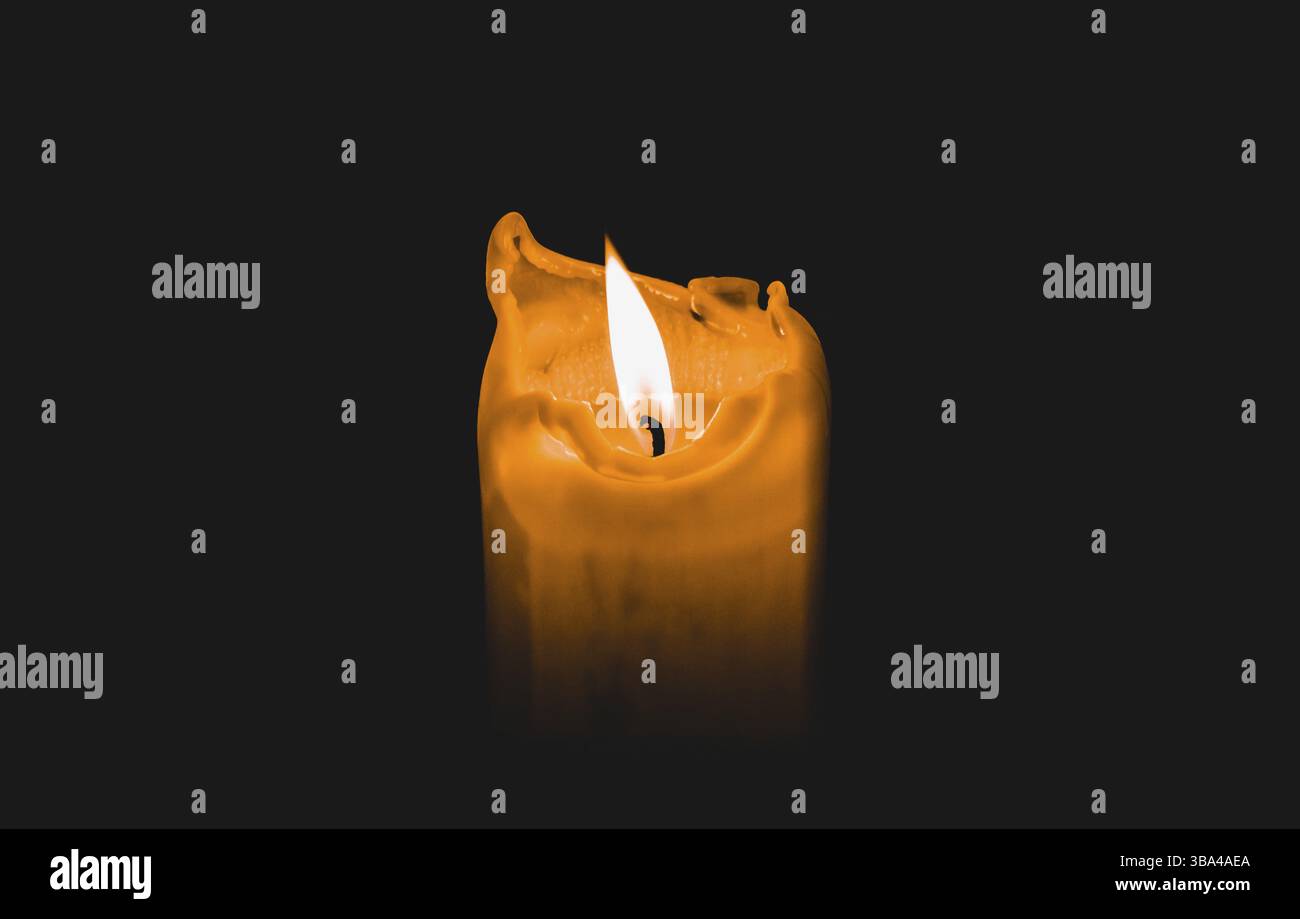 One light candle burning brightly with black background Stock Photo