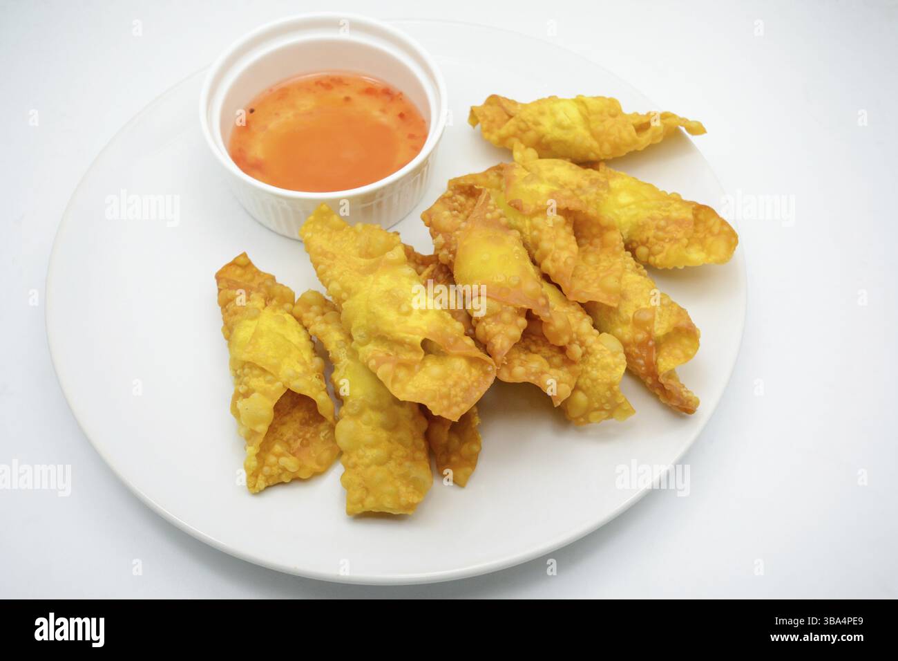 Deep Fried Won ton on white plate with dip source Stock Photo