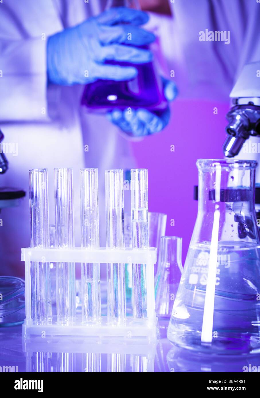 Two scientists in the chemical laboratory are doing experiments Stock Photo