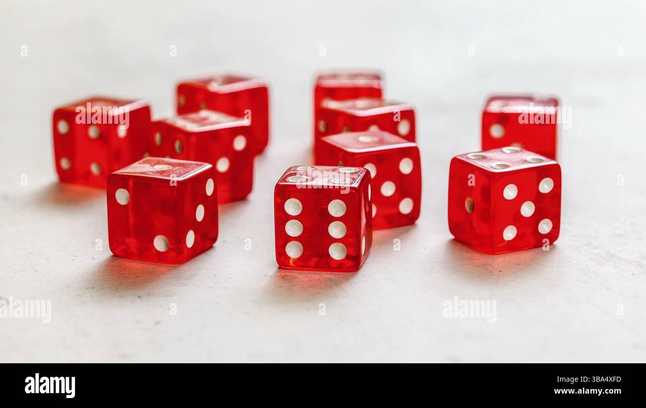 Red craps dices on white board showing different numbers, Liptovsky Hradok, Slovakia, Europe Stock Photo
