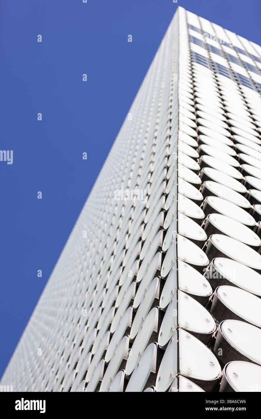 Modern geometric building white circle pattern, blue sky background Stock Photo