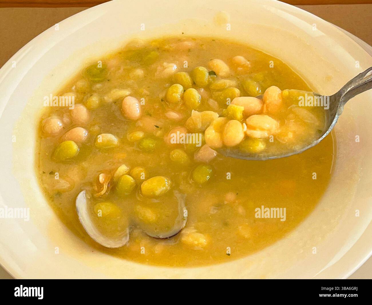 Eating Pochas with clams. Spain. - Smartphone Captured Stock Image