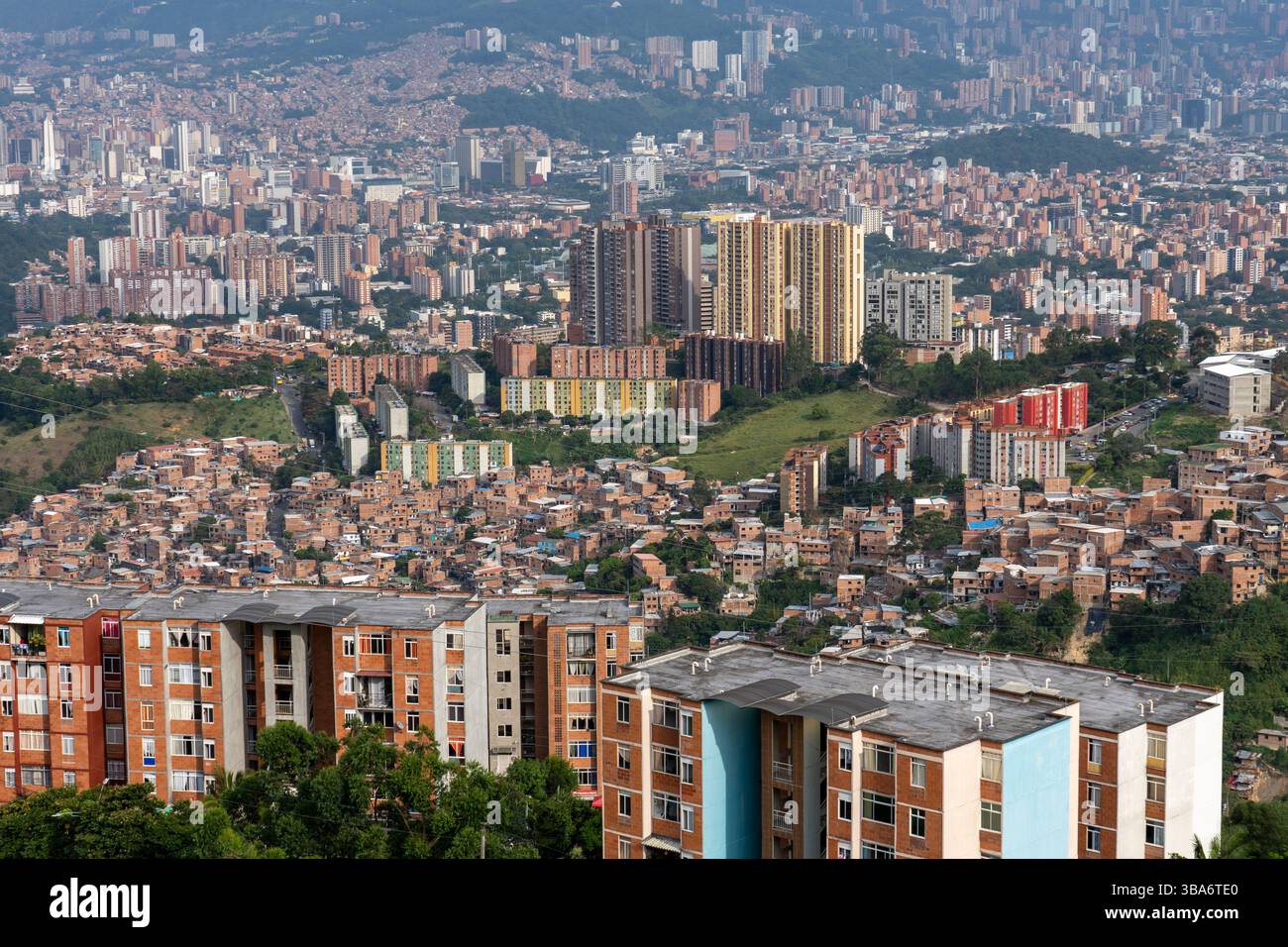 Slums & new high-rise apartment towers in El Pesebre, Comuana 13, with ...