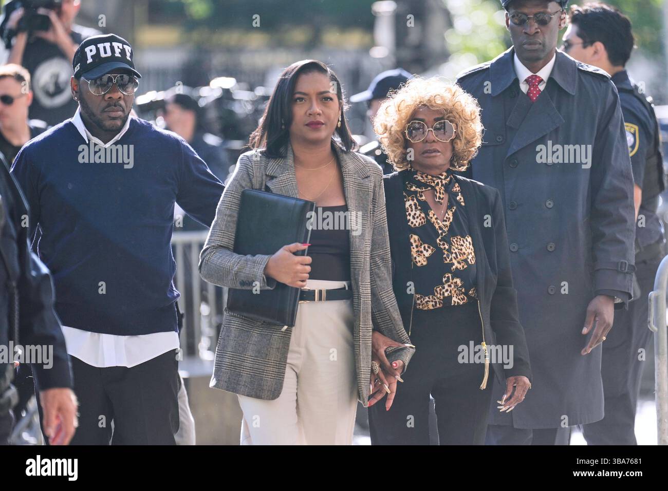 Janice Combs, mother of Sean "Diddy" Combs, second from right, arrives